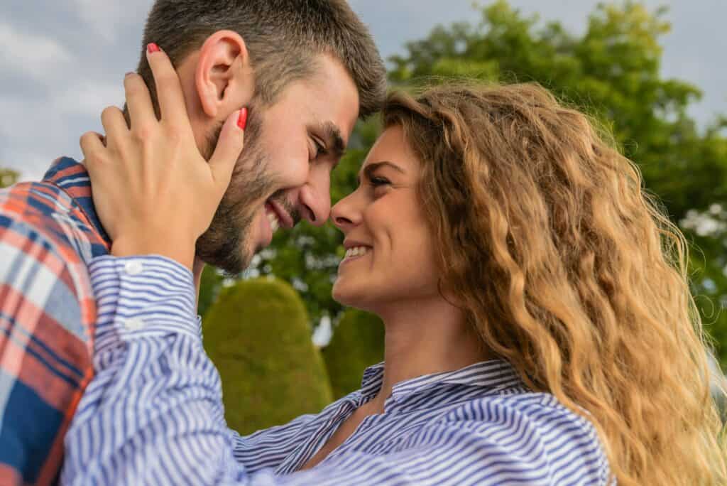 couple face to face smiling